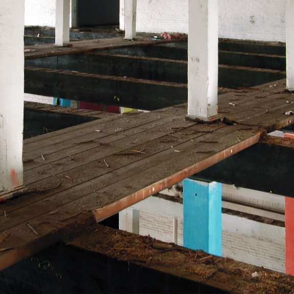 Salvage operation of reclaiming wood old warehouse