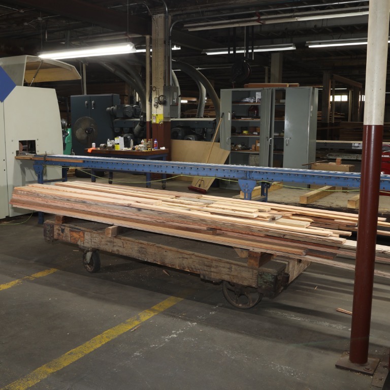 Cart loaded with discounted reclaimed lumber