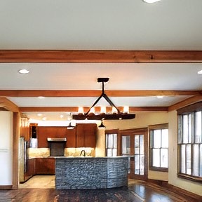 heart-pine-beam-wraps-family-room-kitchen-area