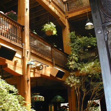 This landmark downtown Richmond, Virginia restaurant features antique heart pine handrails and balustrades; the flooring is heart pine and oak. E.T. Moore can also supply antique beams and columns similar to those seen here. - E.T. Moore Custom Home